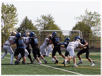 A football player running on the field. Description generated by AI