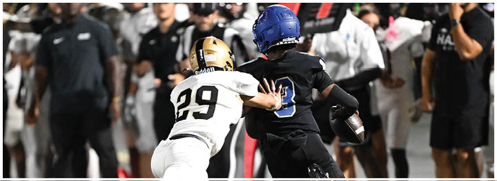 A football player is sliding on the ground. Description generated by AI