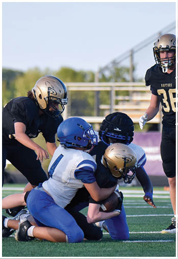 A football player running on the field. Description generated by AI