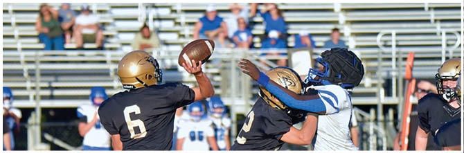 A football player is sliding on the ground. Description generated by AI