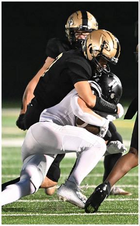 A football player running on the field. Description generated by AI