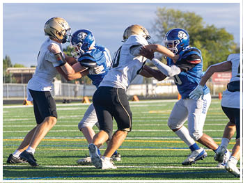 A football player running on the field. Description generated by AI