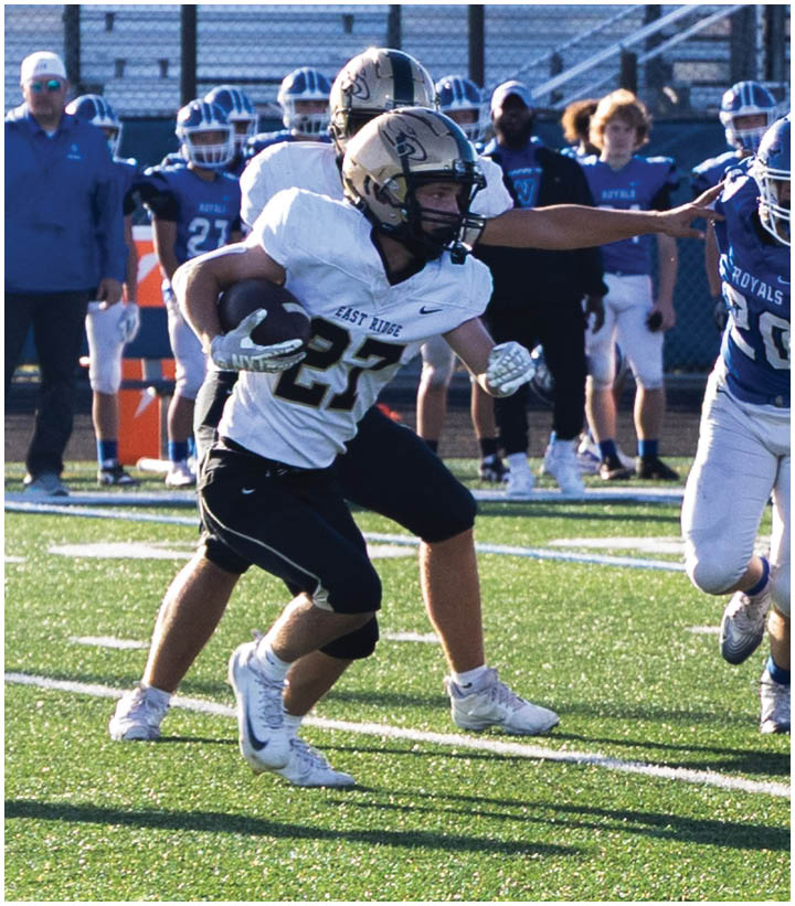A group of football players wearing black and white uniforms. Description generated by AI