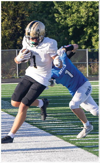 A football player running on the field. Description generated by AI