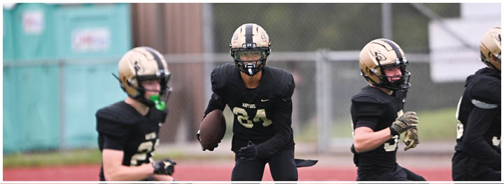 A football player is sliding on the ground. Description generated by AI
