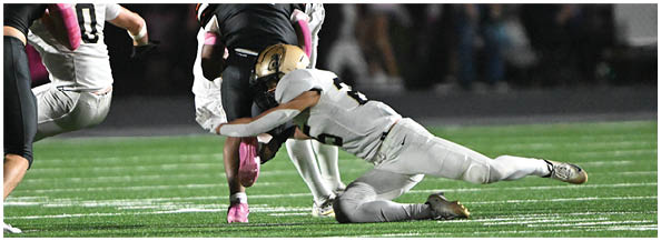 A football player is sliding on the ground. Description generated by AI