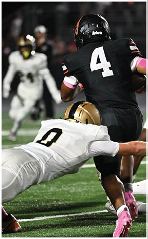 A football player running on the field. Description generated by AI