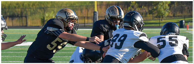 A football player is sliding on the ground. Description generated by AI