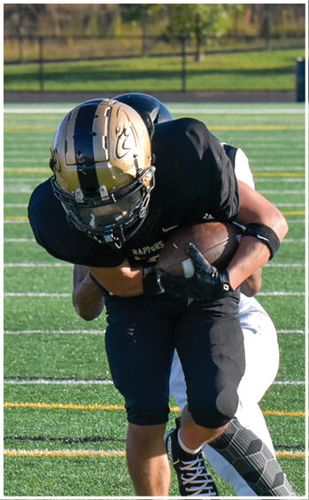 A football player running on the field. Description generated by AI