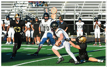 A football player running on the field. Description generated by AI