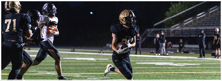 A football player is sliding on the ground. Description generated by AI