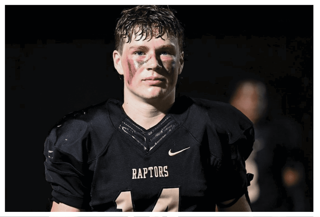 A football player wearing a blue and red jersey. Description generated by AI