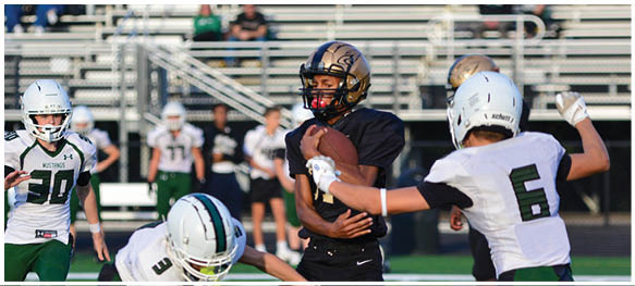 A football player is sliding on the ground. Description generated by AI