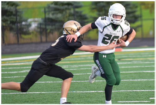 A football player is sliding on the ground. Description generated by AI