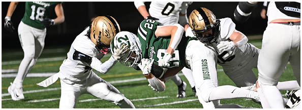 A football player is sliding on the ground. Description generated by AI