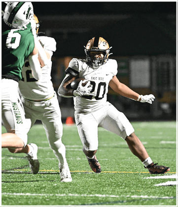 A football player running on the field. Description generated by AI
