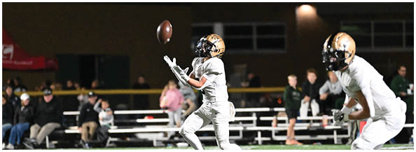 A football player is sliding on the ground. Description generated by AI