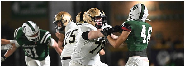 A football player is sliding on the ground. Description generated by AI