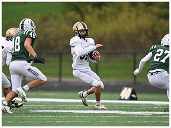 A football player running on the field. Description generated by AI