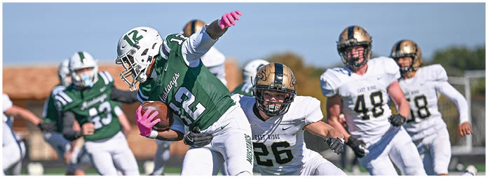 A football player is sliding on the ground. Description generated by AI