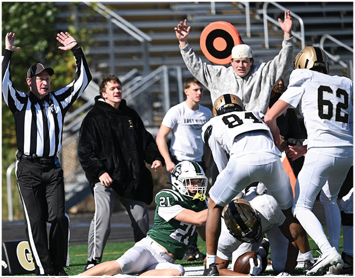A group of football players wearing black and white uniforms. Description generated by AI