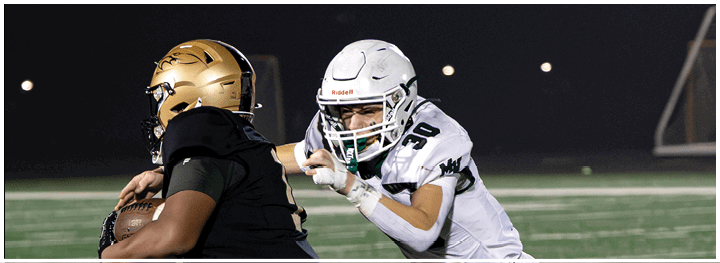 A football player is sliding on the ground. Description generated by AI