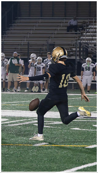 A football player running on the field. Description generated by AI