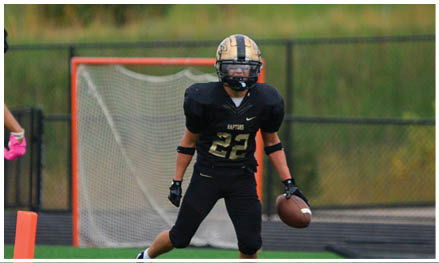 A football player running on the field. Description generated by AI