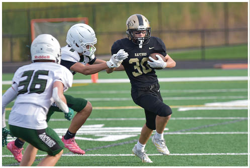 A football player is sliding on the ground. Description generated by AI