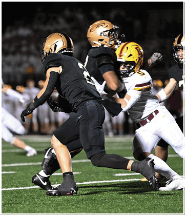 A football player running on the field. Description generated by AI