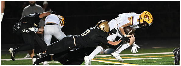 A football player is sliding on the ground. Description generated by AI