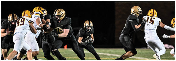 A group of football players on a field. Description generated by AI