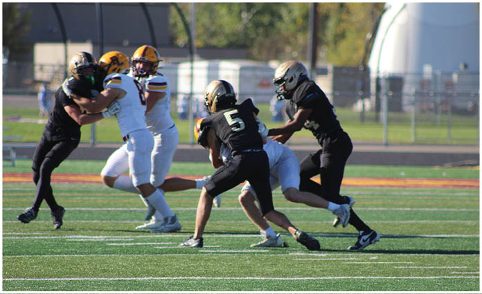 A football player is sliding on the ground. Description generated by AI