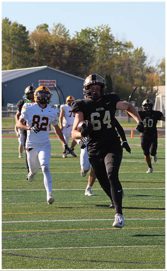 A football player running on the field. Description generated by AI