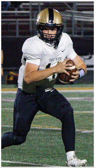 A football player running on the field. Description generated by AI