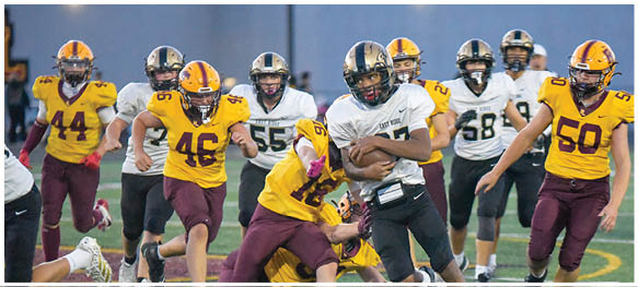 A football player is sliding on the ground. Description generated by AI