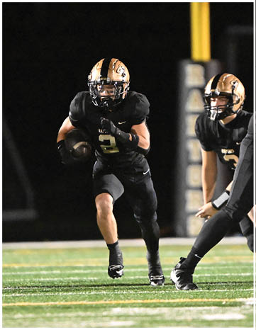A football player running on the field. Description generated by AI