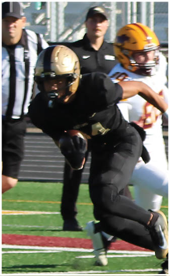 A football player running on the field. Description generated by AI