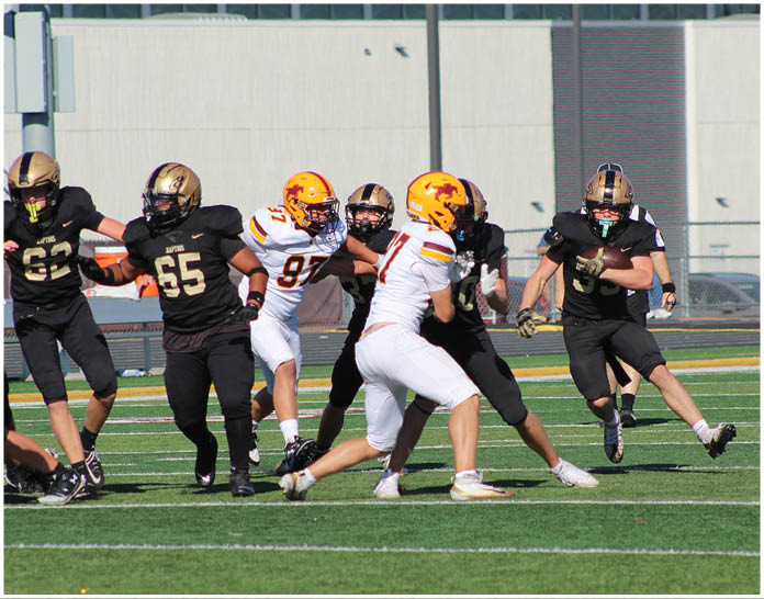 A group of football players wearing black and white uniforms. Description generated by AI