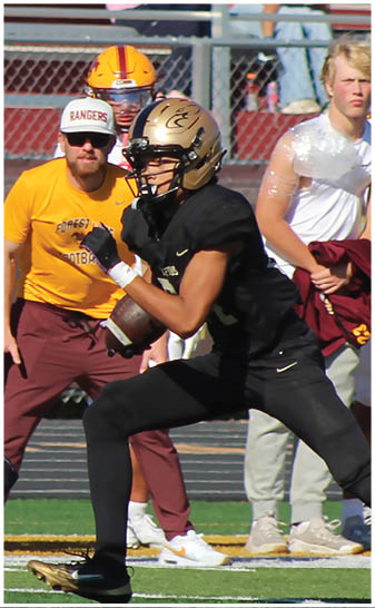 A football player running on the field. Description generated by AI