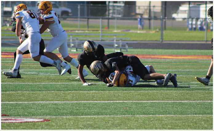 A football player is sliding on the ground. Description generated by AI