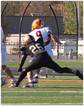 A football player running on the field. Description generated by AI