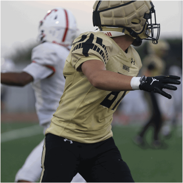 A group of football players celebrating a touchdown. Description generated by AI
