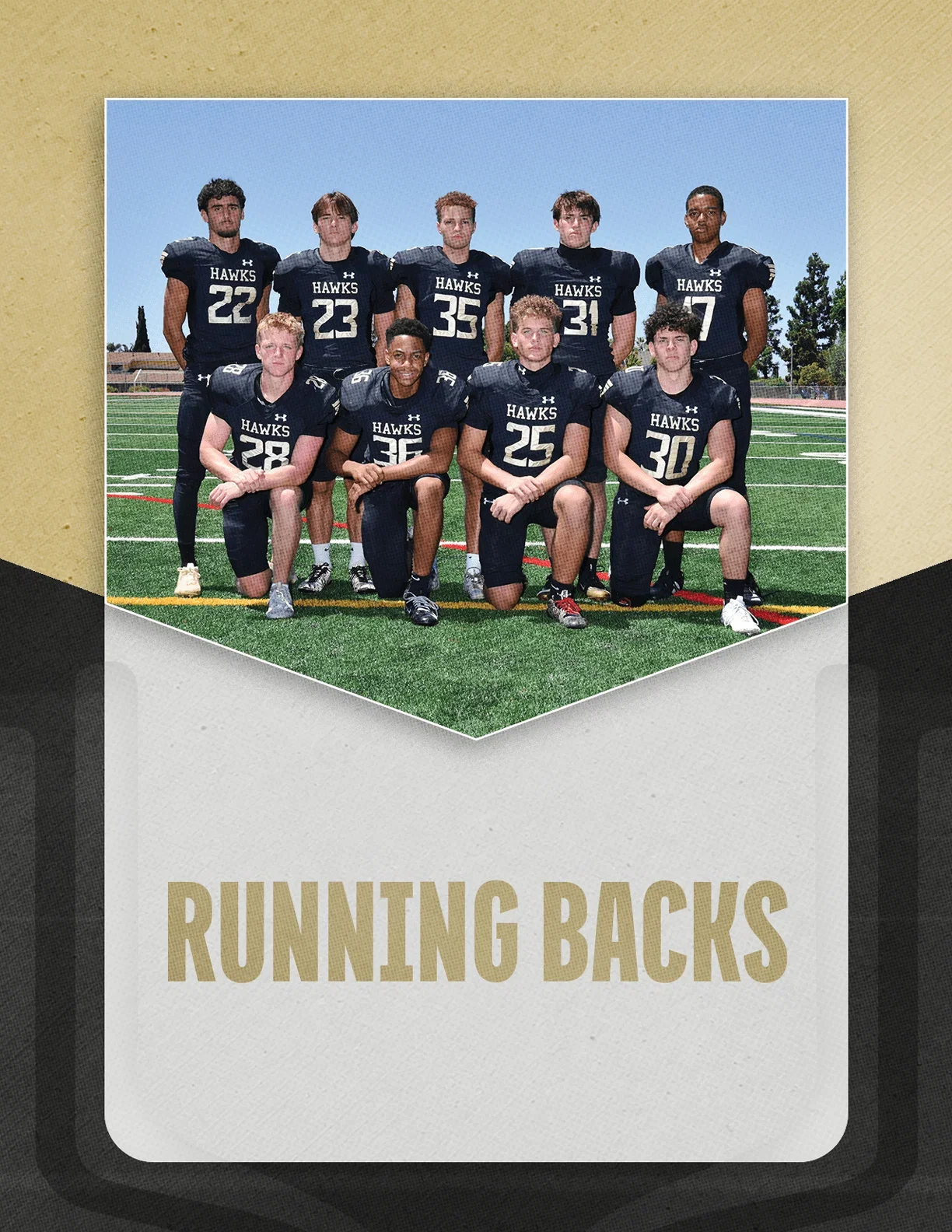 A group of adults wearing black football uniforms with the word “HAWKS" pose on a football field with some standing and others kneeling, above the text "RUNNING BACKS." Description generated by AI