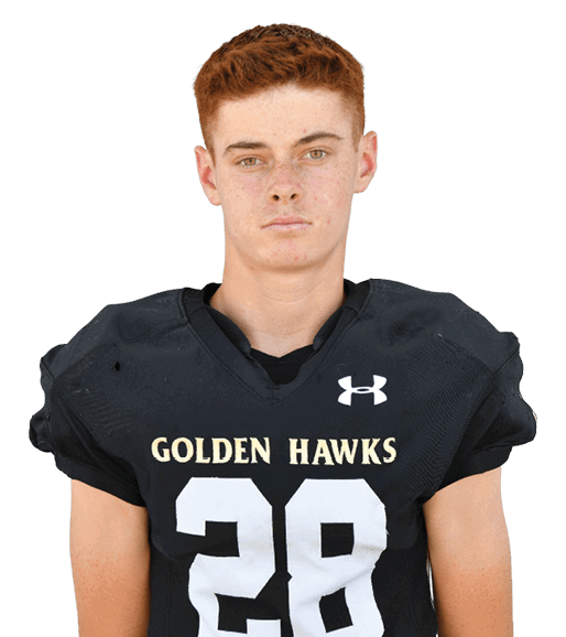 Person with short red hair wearing a black football jersey with the number 28 and the words Golden Hawks. Description generated by AI
