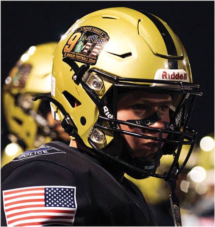 A group of football players celebrating a touchdown. Description generated by AI