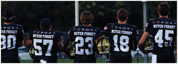 A group of football players on a field. Description generated by AI