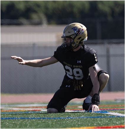 A group of football players celebrating a touchdown. Description generated by AI