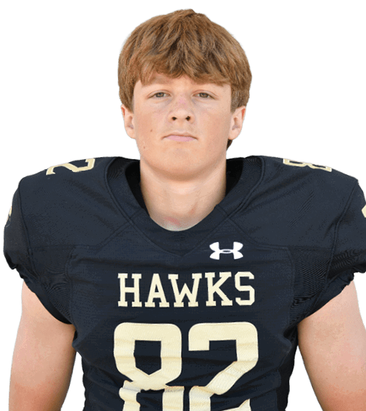 A person with short light brown hair wearing a black football jersey with the word “HAWKS" and the number 82 on the front. Description generated by AI