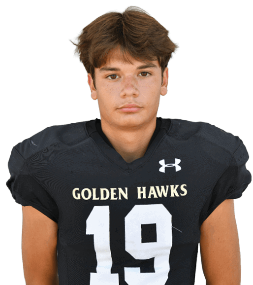 A person with short light brown hair wearing a black football jersey with the word “HAWKS" and the number 82 on the front. Description generated by AI